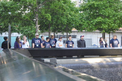Image: IHS band students take time at The World Trade Center Memorial Fountains at Ground Zero.  The memorial lists all those who perished during the attacks on September 11.