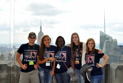 Image: IHS band students stop for a break to gaze at the skyscrapers by Rockefeller.