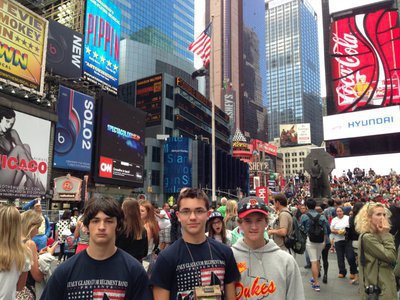 Image: Elliot Worsham, Blake Brewer, and Garrett Janek pause for a quick picture in the crowds of Time Square.