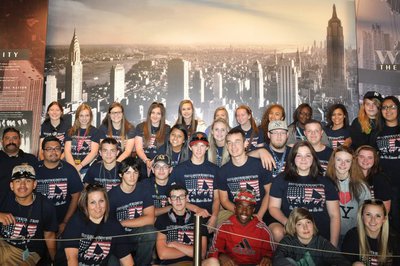 Image: Students pose for a group picture before riding up the 68 stories of Rockefeller Center.