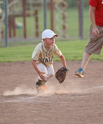 Image: Third baseman Hunter Copeland(2) aggressively covers a grounder in a cloud of dust.