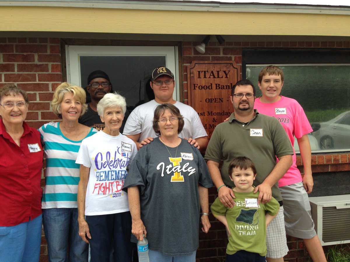 Image: Local residents joyfully follow Christ’s command to feed his sheep by helping at the Italy Food Pantry.