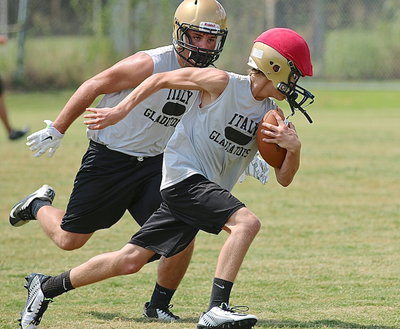 Image: Senior Hunter Merimon sees Maypearl red and freshman Garret Janek sees a problem with wearing red helmet covers.