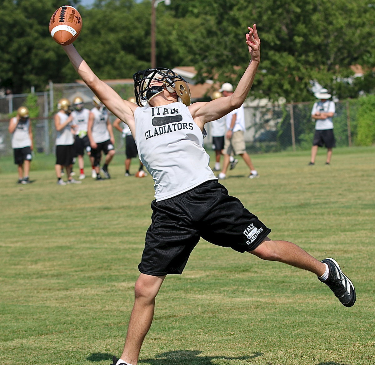 Image: Dylan McCasland stretches out in a ttempt to reel in a pass.