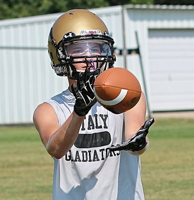 Image: Hunter Ballard clamps down on a pass during a route running drill.