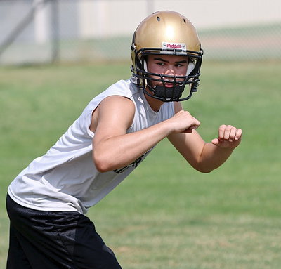 Image: Freshman Kyle Tindol, the son of head coach Charles Tindol, is determined to impress his coach.