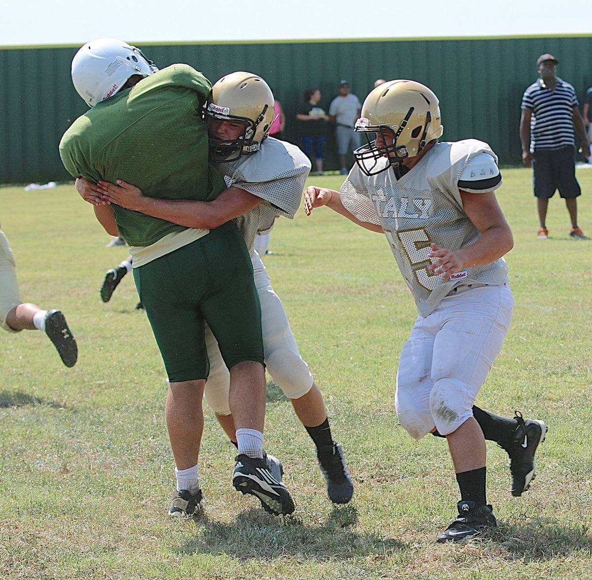 Image: JV Gladiator Eli Garcia(36) hits the Eagle quarterback to force a scrimmage-ending incompletion.