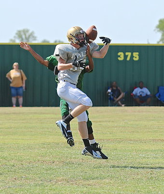 Image: Senior receiver Cody Boyd(34) attempts to haul in a pass thrown deep downfield.