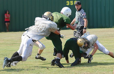 Image: Italy linebacker Kyle Fortenberry(50) brings down an Eagle ball handler.