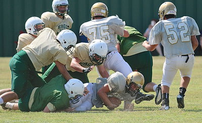 Image: JV Gladiator running back Kyle Tindol(22) stretches out for an extra yard.