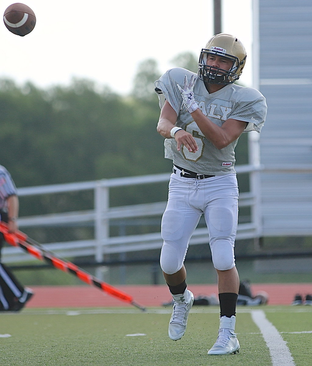 Image: Sophomore QB Joe Celis(6) prepares to lead the Gladiators in a scrimmage against the Palmer Bulldogs and beyond….