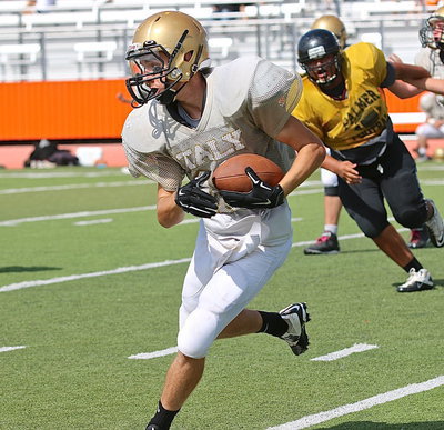 Image: Gladiator Ryan Connor takes reps at quarterback. Connor was a standout receiver and defensive back last season.