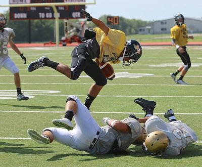 Image: A Palmer receiver uses an athletic move to avoid being tackled.