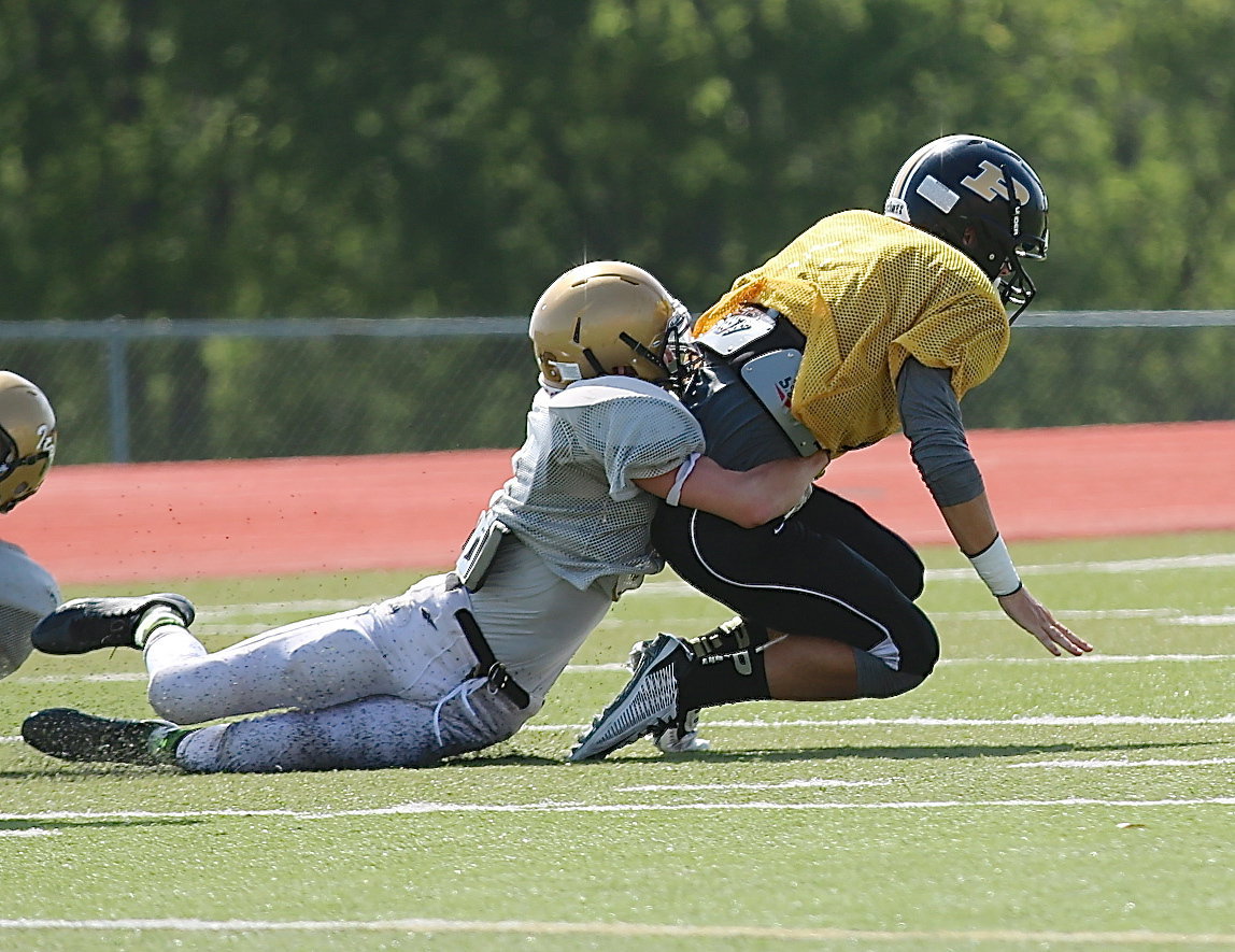 Image: Gladiator Clayton Miller(6) drags down a Palmer receiver.