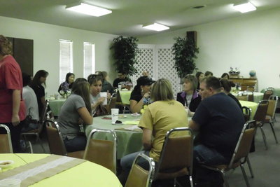Image: The school personnel take a much needed break from in-service to visit with each other.