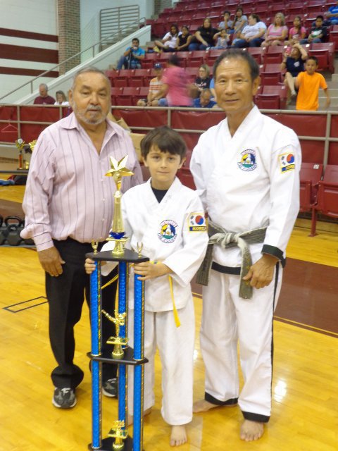 Image: Pictured is Master Charles Kight, chief instructor of the Hillsboro TKD school,  Antonio and Grand Master Park co-founder of Unified TKD.