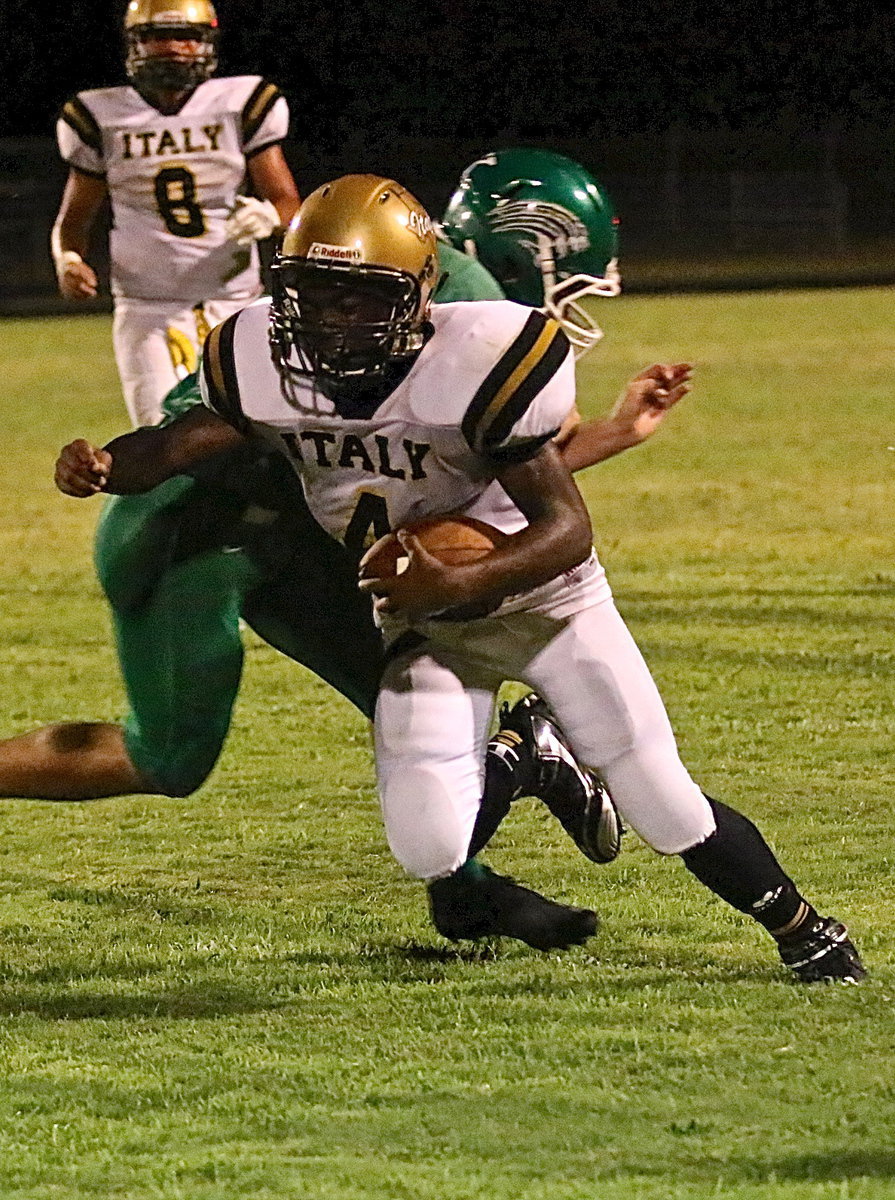 Image: Kendrick Norwood(4) avoids a Bobcat tackler for additional yardage.