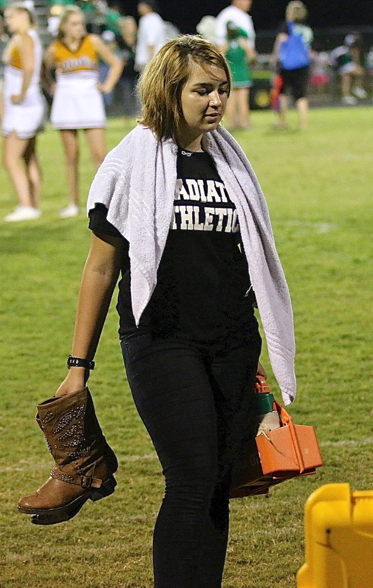 Image: Football in Texas — Water bottles and cowboy boots.