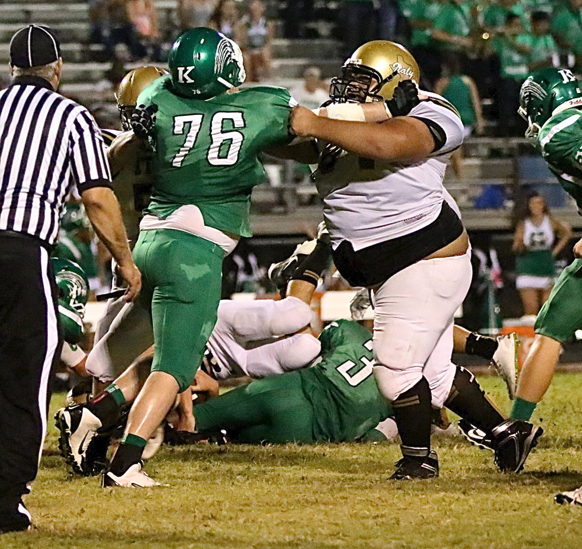 Image: Ty Fernandez(64) manhandles a Bobcat defenseman.