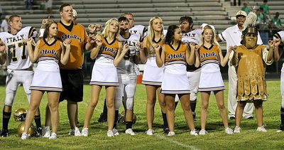 Image: The school song — Clay Riddle(77), Brooke DeBorde, Zac Mercer, Halee Turner, Hunter Merimon(3), Colin Newman(76), Annie Perry, Ashlyn Jacinto, Ty Fernandez, Britney Chambers, Coach Bobby Campbell and Gladiator mascot Noeli Garcia show their school pride.