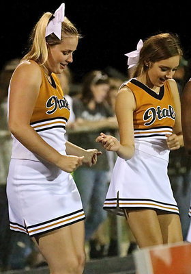 Image: Italy cheerleaders Madison Washington and Jozie Perkins practice their moves as they settle in for the 2014 season.