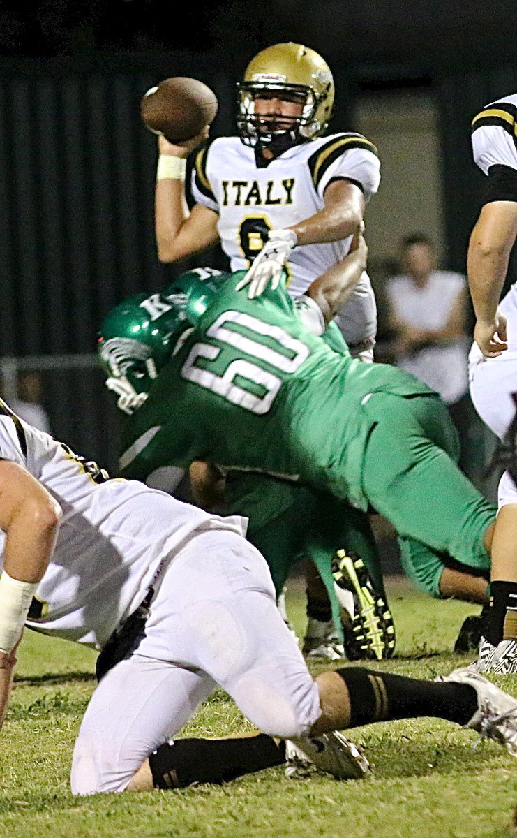 Image: Gladiator sophomore quarterback Joe Celis(8) was courageous in battle during his first start on varsity despite constant pressure from the Bobcat defense.