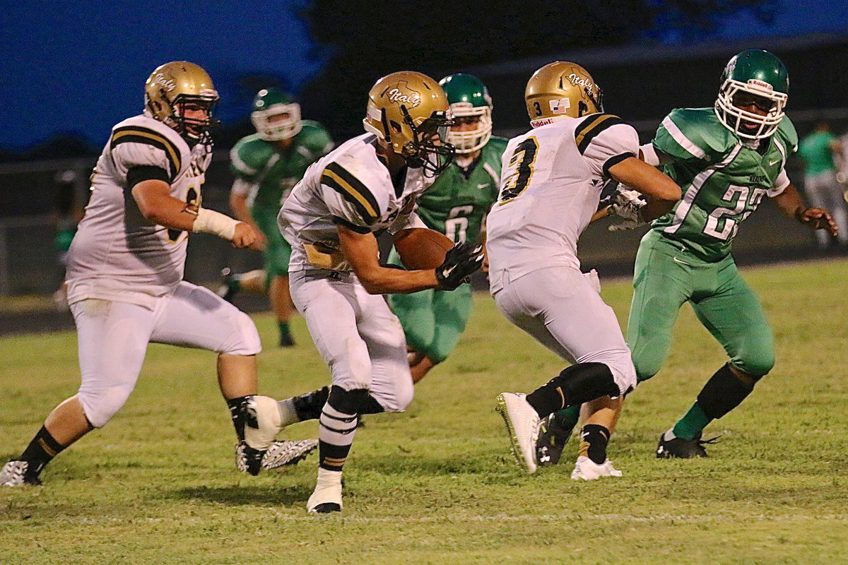 Image: Italy receiver Levi McBride(1) runs behind teammates John Byers(60) and Hunter Merimon(3).