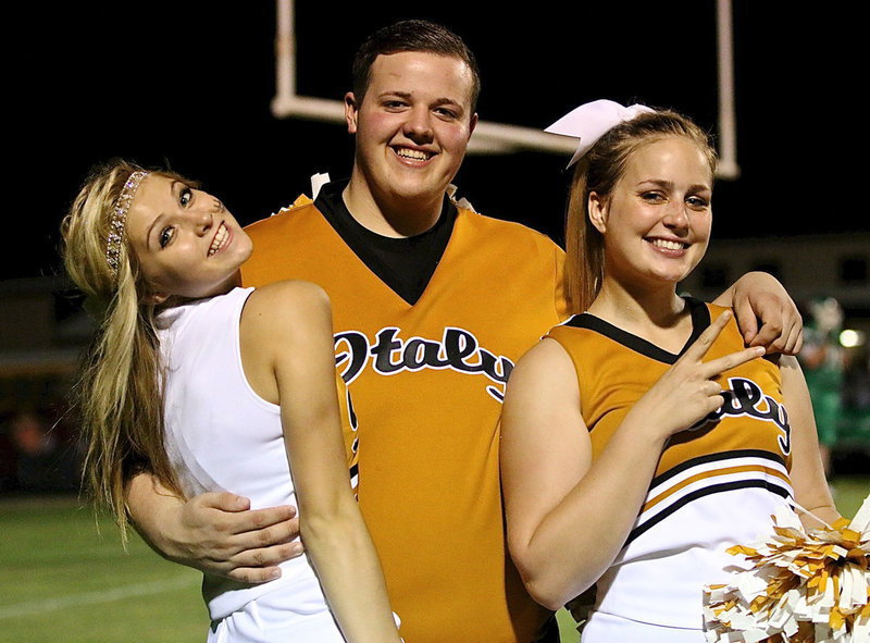 Image: Italy’s Halee Turner, Zac Mercer, who made his cheerleading debut this past Friday night, and Madison Washington are smiled up for the season!