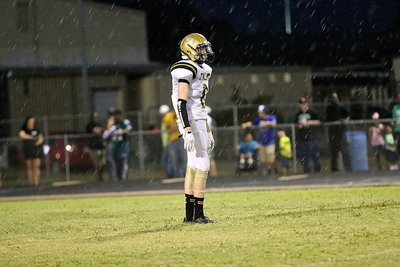 Image: Italy’s Clayton Miller(6) awaits a Kerens’ kickoff in the rain.