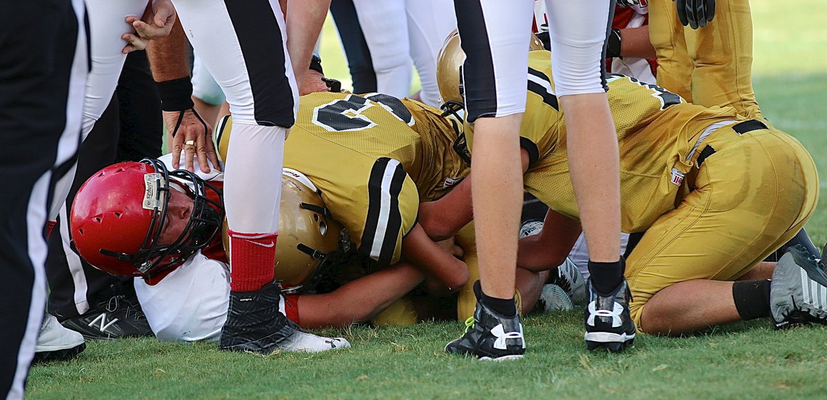 Image: Dylan McCasland(3) and teammate Eli Garcia(7) scrum for a Maypearl fumble. McCasland was credited with the recovery.