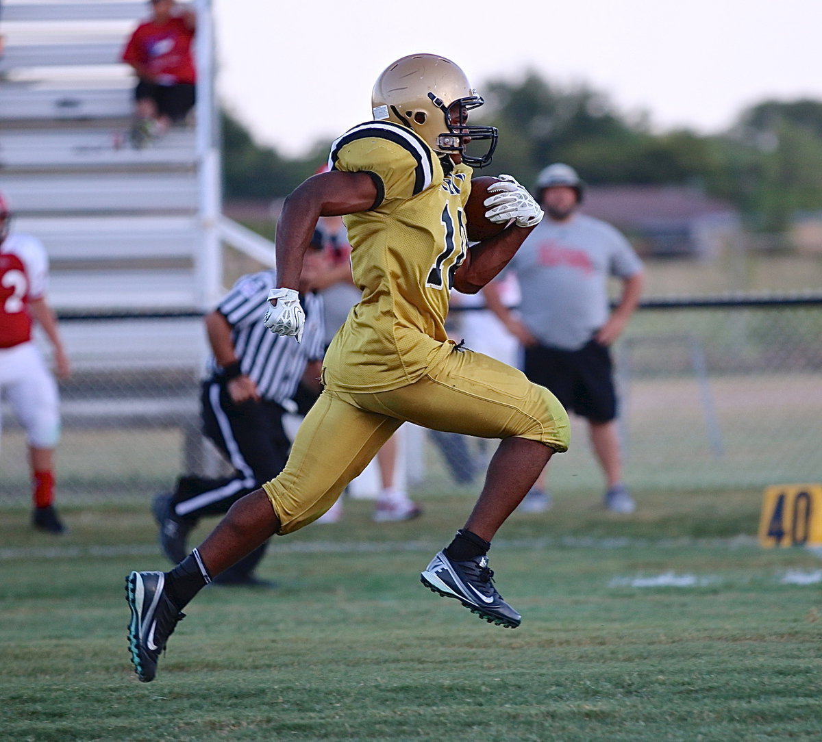 Image: He gone again! — Jaray Anderson(10) leaves Maypearl tacklers behind as he returns a kickoff for a touchdown.