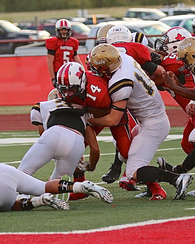 Image: Hunter Merimon(3) and Cody Boyd(15) clamp down on a Maypearl Panther ball carrier.