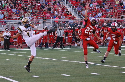 Image: Gladiator punter Levi McBride(1) sends a punt down to the Panther 2-yard line.
