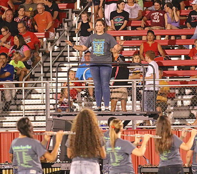 Image: Drum Major Alexis Sampley and the award-winning Gladiator Regiment Marching Band entertain the Maypearl fans with their halftime performance.
