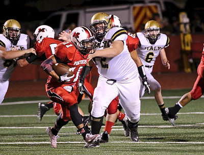 Image: Aaron Pittmon(72) bullies his way into the Maypearl backfield to tackle a Panther for a loss.