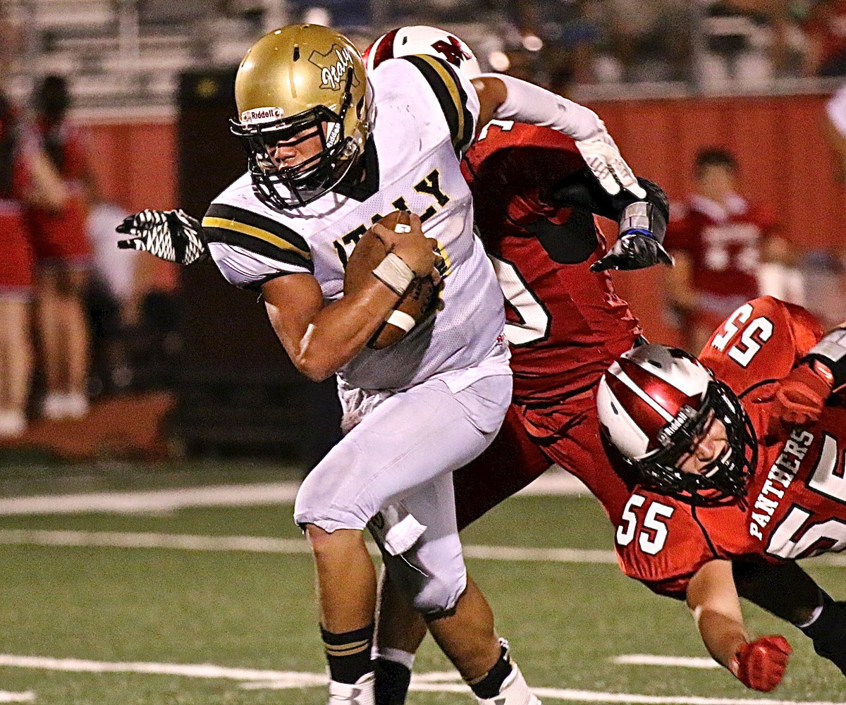 Image: Quarterback Joe Celis(8) gets the Gladiators moving in the second-half against Maypearl.