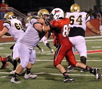 Image: Gladiator right tackle John Byers(60) protects his quarterback.