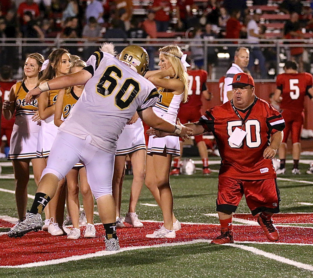 Image: Over the past four seasons, the record between Italy and Maypearl has been 2-2. Italy senior John Byers(60) and Maypearl’s spirit leader Clint Holley(50) show mutual respect after the game.