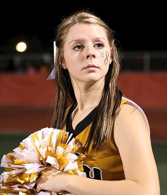 Image: Italy High School cheerleader Brooke DeBorde waits for the cue from the band.