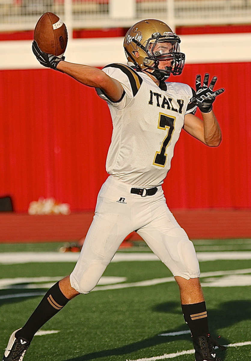 Image: Backup quarterback Ryan Connor(7) warms up before the game against Maypearl.