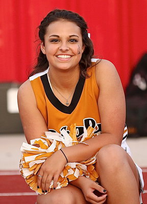 Image: Italy High School Cheerleader Ashlyn Jacinto sports a smile during a timeout.