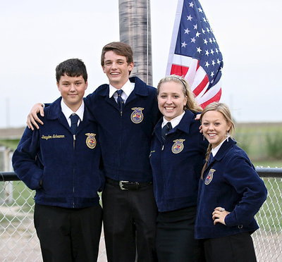 Image: Italy FFA officers Brayden Schramm​, Ty Windham, Jaclynn Lewis and Bailey Eubank are about to raise the flag during the pre-game ceremony.