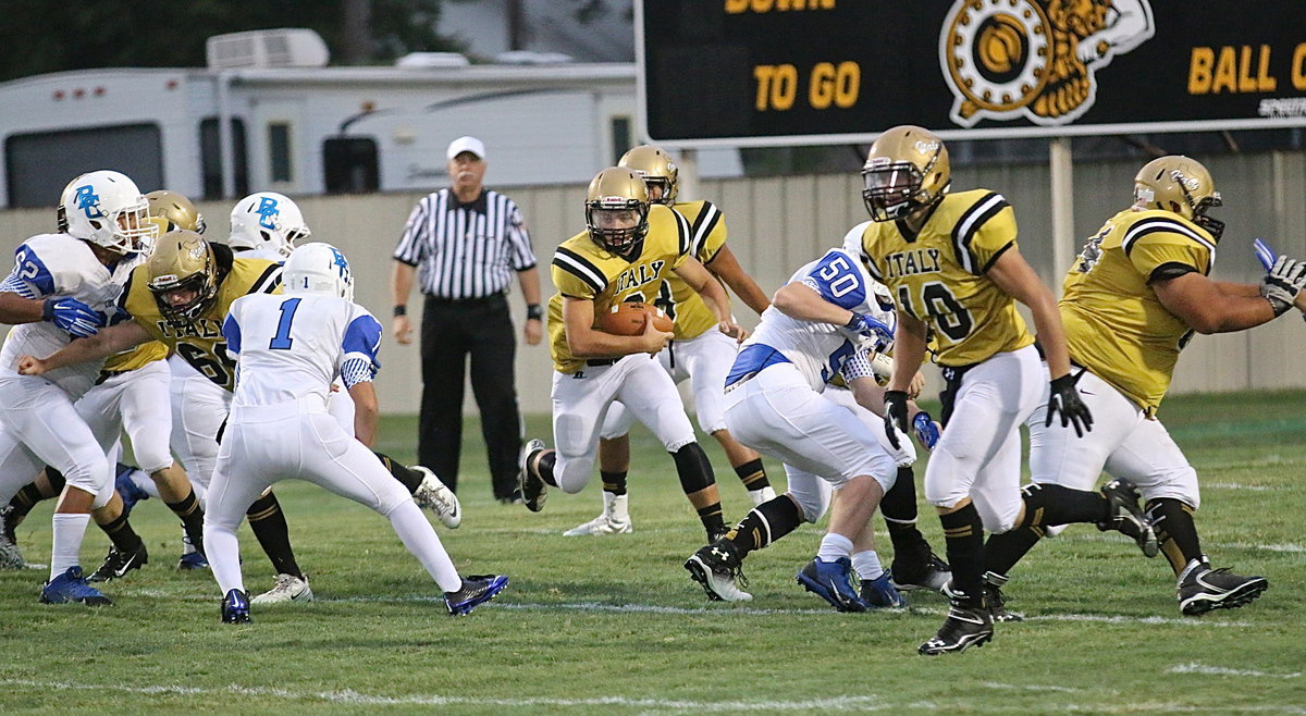 Image: Hunter Merimon(3) sees a running lane behind center Kyle Fortenberry(66), guard John Escamilla, tackle Ty Fernandez(64) and lead back Coby Jeffords(10).