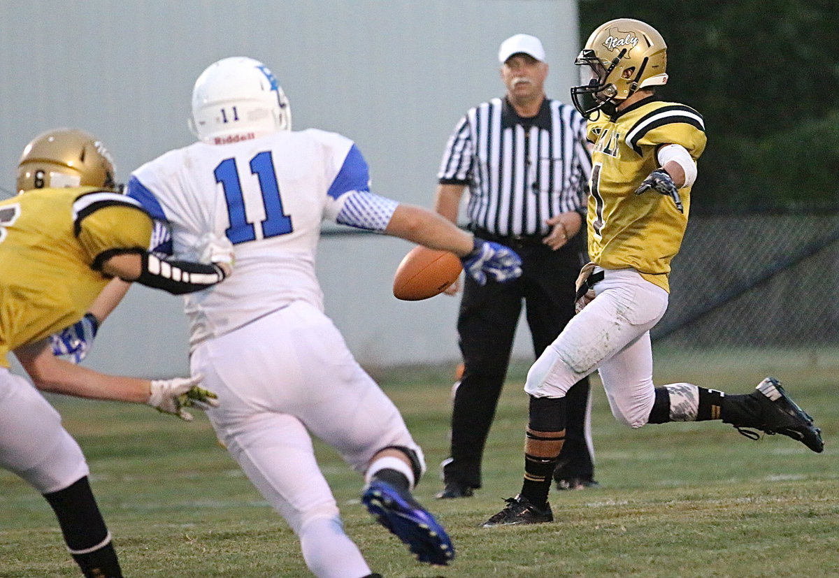 Image: Levi McBride(1) punts it away for Italy. McBride punted 5 times for 142 yards and a 28.4 yard average.