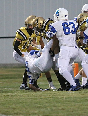 Image: Inside linebacker Coby Jeffords(10) form tackles a BG Lion in the hole.