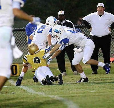 Image: Clayton Miller(6) makes a touchdown saving tackle for the Gladiators.