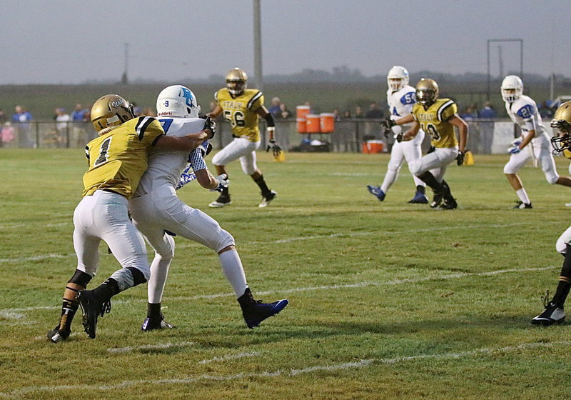 Image: Levi McBride(1) has tight coverage near the goal line as teammate Ryan Connor(7) (just entering the frame on the right side) arrives to dislodge the ball.
