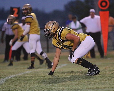 Image: Gladiator Coby Jeffords(10) is about to fire-off like a missile from his fullback position.