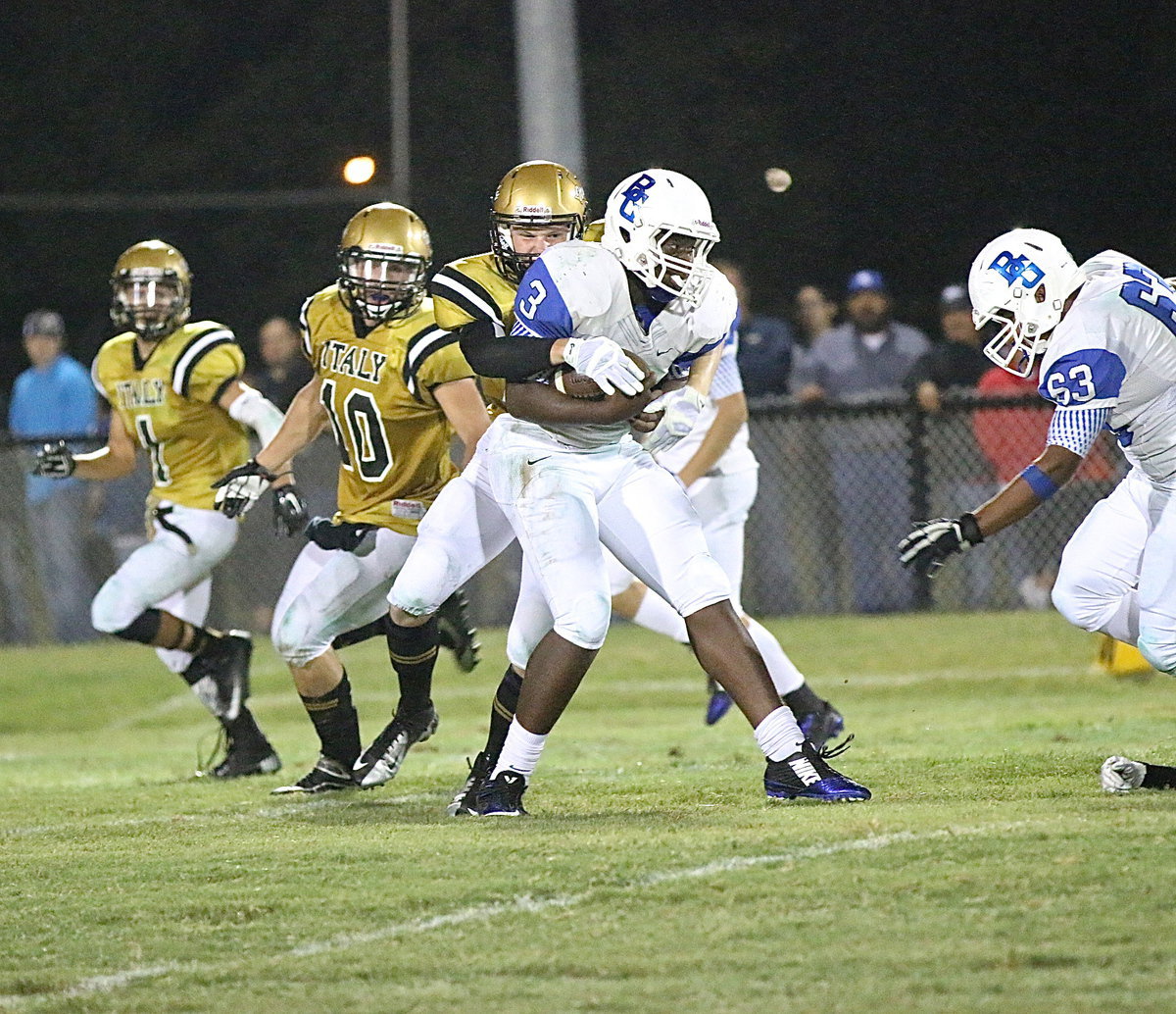 Image: Senior Gladiator Cody Boyd(15) wrestles down a Lion running back.