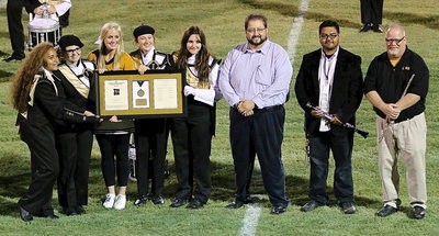Image: Italy ISD Superintendent Jaime Velasco presents the Gladiator Regiment Band with a framed bronze medal display to commemorate their accomplishment this summer while competing in the State Honor Band contest. Accepting on behalf of the GRB are director Jesus Perez, assistant director David Graves, and band representatives Vanessa Cantu, Reagan Adams, Madison Washington, Whitney Wolaver, Alexis Sampley.